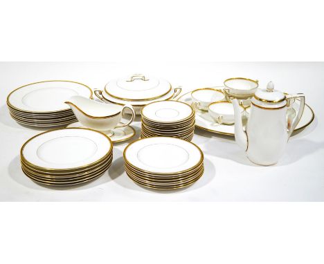 A Royal Worcester Viceroy pattern dinner service, white with gilt banding, comprising: 8 x dinner plates, 8 x medium plates, 