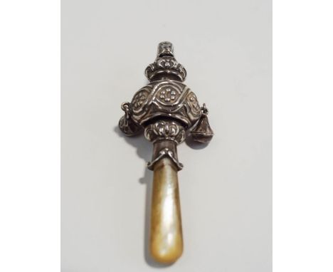 A silver and mother of pearl teether, whistle rattle, Birmingham 1923, in the antique style, 8.5 cm long