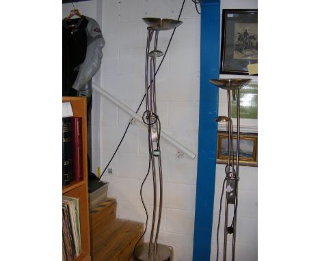 A floor standing brushed chrome uplighter with reading light 