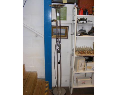 A floor standing brushed chrome uplighter with reading light 