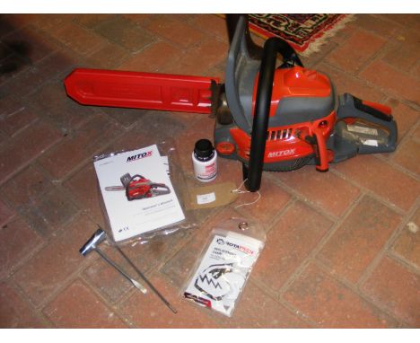 A Mitox 385CSX Premium Chainsaw and accessories 