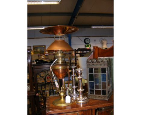 A converted brass and copper lamp, together with a pair of silver plated candlesticks and a stain glass light shade CONDITION