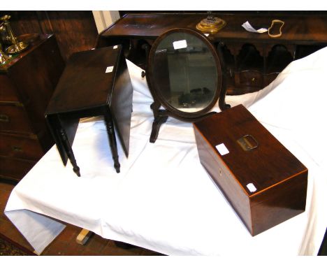 An apprentice piece miniature mahogany drop leaf table, together with a tea caddy with glass mixing bowl and toilet mirror