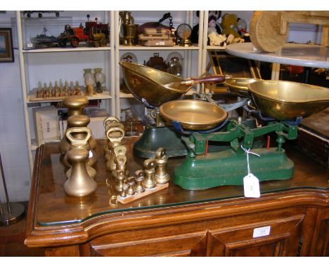 Two vintage kitchen scale sets, together with assorted brass weights 