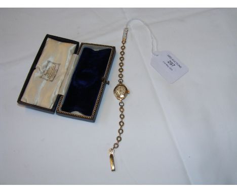 A gold cased ladies wrist watch with original box