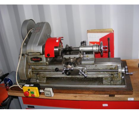 A Myford bench mounted lathe with manual etc.