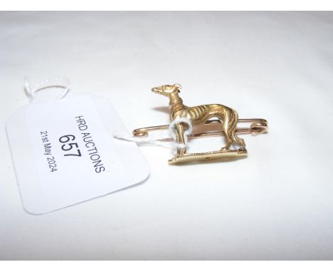 An unusual greyhound brooch in gold mount