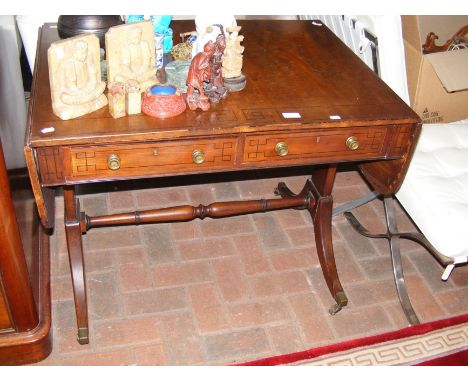 An antique mahogany sofa table with drawers to the front on shaped support