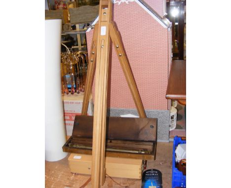 A parallel rolling rule in box, a Medway table box easel and one other easel