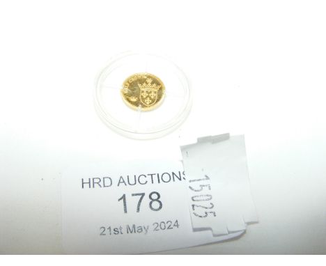A small gold Commemorative coin, 2009