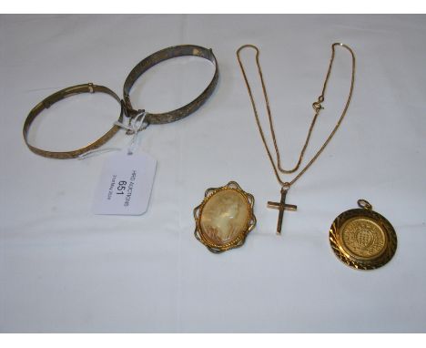 A gold cross, bangles etc.