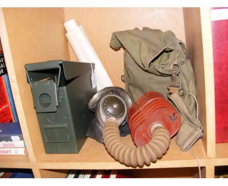 A WWII era gas mask, together with other Army items 