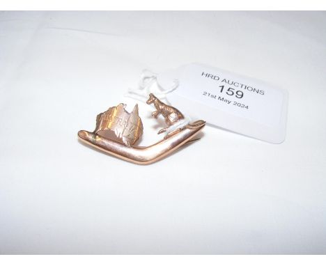An old gold brooch in the form of a boomerang and kangaroo