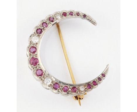 AN 18CT WHITE GOLD RUBY AND DIAMOND BROOCH, groups of round-cut rubies spaced by round brilliant-cut diamonds, hallmarked Bir