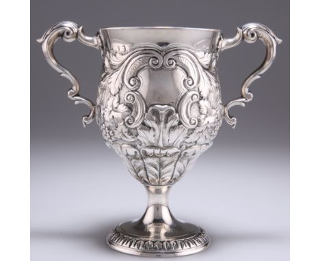A GEORGE III IRISH SILVER TWO-HANDLED CUP,&nbsp;by&nbsp;Matthew West, Dublin 1788, with pedestal foot, the handles with leaf-