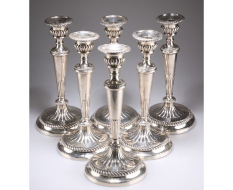 A RARE SET OF SIX GEORGE III LARGE SILVER TABLE CANDLESTICKS, by John Green, Roberts, Mosley & Co, Sheffield 1803 and 1804, t