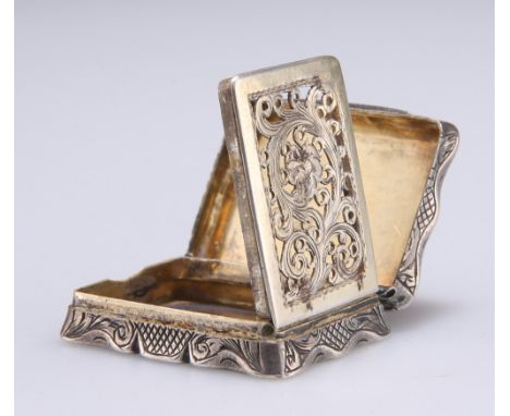 A VICTORIAN SILVER VINAIGRETTE,&nbsp;by Edward Smith,&nbsp;London 1848, of shaped rectangular outline, engine-turned decorati