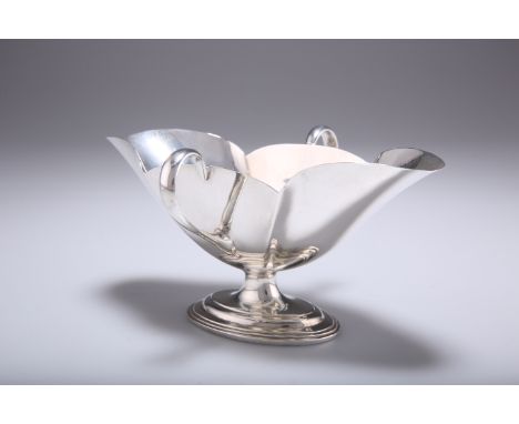A VICTORIAN SILVER DOUBLE LIP SAUCEBOAT,&nbsp;by Thomas Bradbury &amp; Sons, London 1896, with twin lug handles, raised on a 