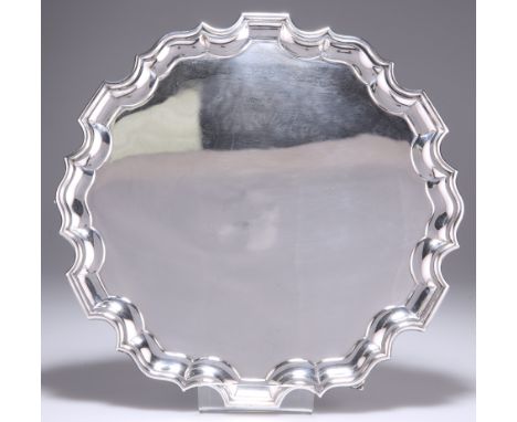 A GEORGE V SILVER SALVER,&nbsp;by Stevenson &amp; Law,&nbsp;Sheffield 1934, plain shaped circular with Chippendale style bord