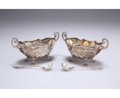 A PAIR OF ART NOUVEAU SILVER SALTS,&nbsp;by&nbsp;Henry Matthews, Birmingham 1904, of two-handled shaped oval form, each chase
