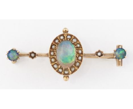 A LATE VICTORIAN BLACK OPAL AND SEED PEARL BROOCH, an oval opal within a border of split seed pearls, to a knife-edge bar set