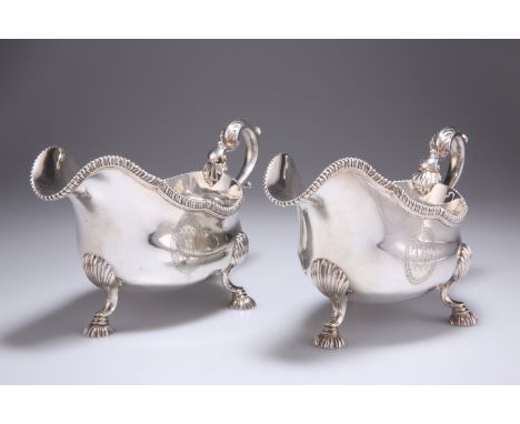 A FINE PAIR OF GEORGE III SILVER SAUCEBOATS,&nbsp;by Philip Norman,&nbsp;London 1769, each with gadrooned rim and leaf-capped