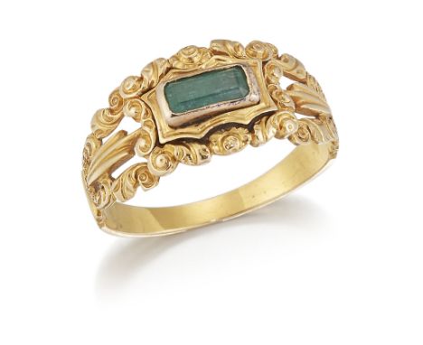 A 19TH CENTURY EMERALD RING, an octagonal-cut emerald in a bezel setting within a fancy repoussé scroll frame and split shoul