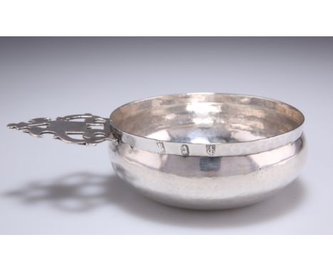 A WILLIAM III BRITANNIA SILVER BLEEDING BOWL, by Edward Wimans, London 1698, circular with pierced side handle, scratched 'R 