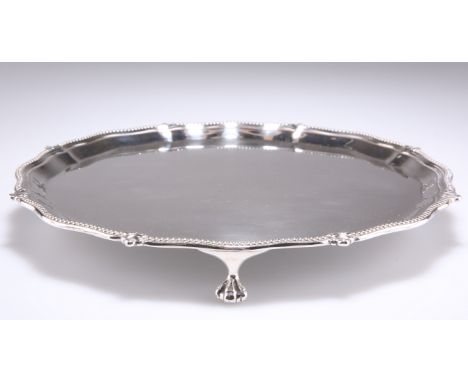 A GEORGE V SILVER SALVER,&nbsp;by Albert Faulkner, Sheffield 1922, shaped octagonal, the beaded rim intersected with foliate 