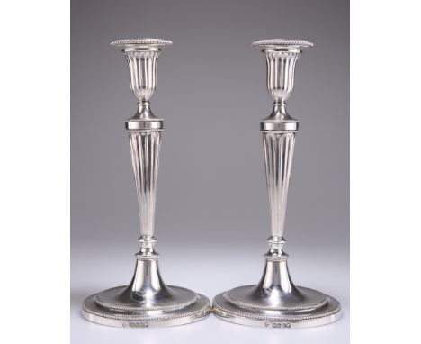 A FINE PAIR OF VICTORIAN CAST SILVER CANDLESTICKS,&nbsp;by&nbsp;Richard Martin &amp; Ebenezer Hall, London 1880, in the Neocl