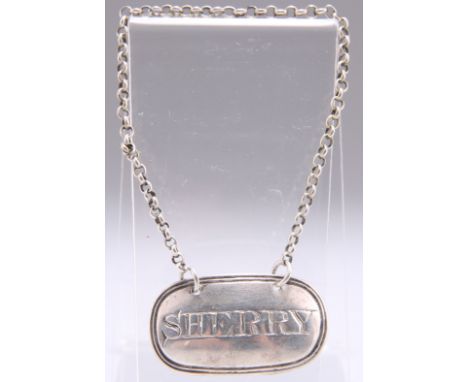 A GEORGE III SILVER DECANTER LABEL,&nbsp;by&nbsp;Charles Rawlings, London 1818, reeded oval form, engraved 'SHERRY'. 4.2cm wi