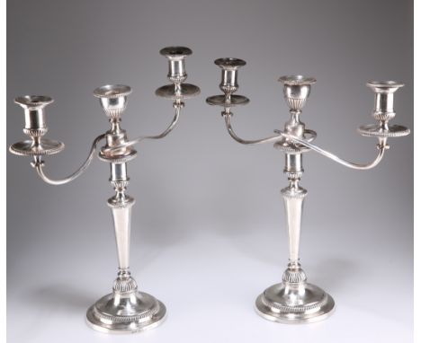 A PAIR OF GEORGE III SILVER AND OLD SHEFFIELD PLATE THREE-LIGHT CANDELABRA,&nbsp;by&nbsp;Matthew Boulton, Birmingham 1802, ea