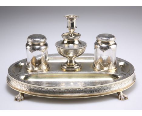 A VICTORIAN SILVER-GILT DESK STANDISH, by George Fox, London 1868, oval, with two pen trays and two pin trays, all bordered w