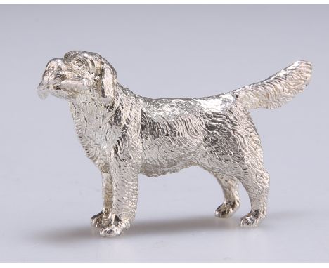A CAST SILVER MODEL OF A RETRIEVER, maker's mark 'JS & MJ', London 2009, the dog holding a stick in its mouth. 4.7cm long, 1 
