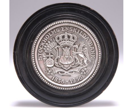 A BANK OF SWEDEN SILVER PAPERWEIGHT, by Sporrong &amp; Co, in a wooden mount. 11cm diameterThe absence of a Condition Report 