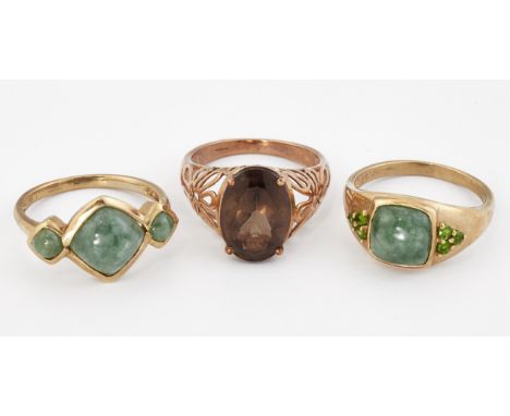 THREE 9CT GOLD GEM-SET RINGS, comprising; A 9CT GOLD JADE THREE STONE RING, ring size S; A 9CT GOLD JADE AND GREEN GARNET RIN