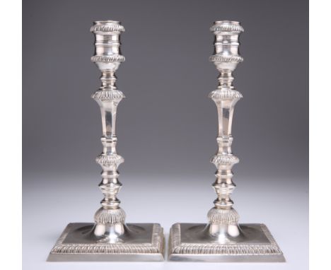 A PAIR OF GEORGE III STYLE CAST SILVER CANDLESTICKS,&nbsp;by&nbsp;C J Vander Ltd, London 1974, each with knopped stem and squ