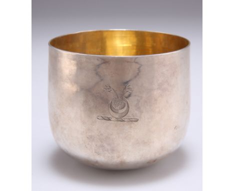 A GEORGE III SILVER TUMBLER CUP,&nbsp;maker CB, London 1776, engraved with a crest, gilded interior. 7cm high, 2.9 troy ounce