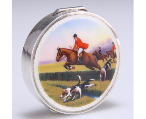 A SILVER AND ENAMEL COMPACT,&nbsp;import marks, TK &amp; Co, London 1929, circular, the hinged cover enamelled with a fox hun