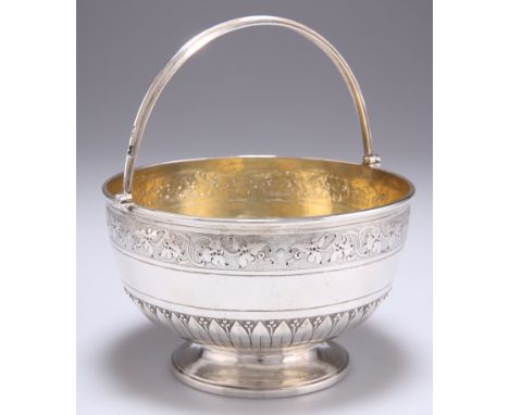 A VICTORIAN SILVER SWING-HANDLE SUGAR BOWL,&nbsp;by&nbsp;Henry Holland, London 1878, circular, chased with a band of scrollin