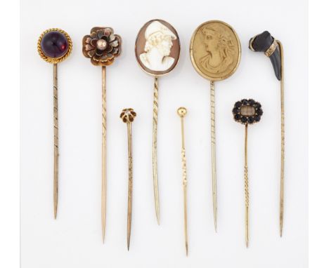 A GROUP OF EIGHT STICK PINS, including; A FOSSILISED TOOTH EXAMPLE; A CAMEO EXAMPLE DEPICTING THE BUST OF MARS; AND A DIAMOND