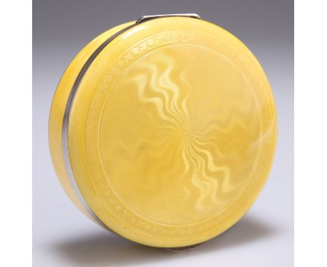 A STRIKING CONTINENTAL SILVER AND YELLOW ENAMEL BOX, EARLY 20TH CENTURY,&nbsp;circular, with guilloche pattern to the hinged 