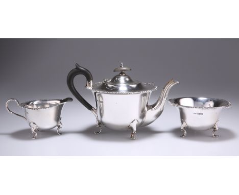 AN EDWARDIAN SILVER THREE-PIECE BACHELORS TEA SERVICE, by George Howson, Sheffield 1908, circular with gadrooned and foliate 