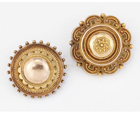TWO VICTORIAN ETRUSCAN REVIVAL BROOCHES, each of circular form with beaded decoration, domed centres and glazed locket backs.
