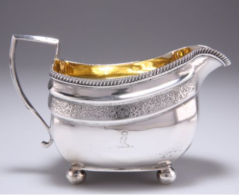 A GEORGE III SILVER CREAM JUG,&nbsp;by Crispin Fuller, London 1807, squat shaped oval with reel moulded rim, with a band of f