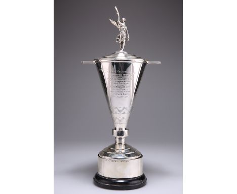 AN ART DECO SILVER TROPHY AND COVER ON STAND, by Walker & Hall, Sheffield 1935, the stepped circular cover surmounted by the 