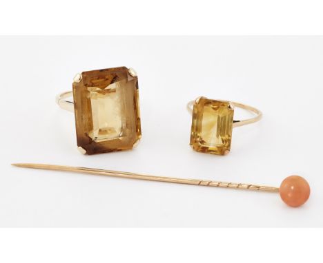 TWO RINGS, comprising;&nbsp;A CITRINE COCKTAIL RING, a large octagonal-cut citrine in a claw setting, ring size P1/2;&nbsp;AN