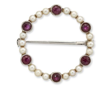 A RUBY AND SEED PEARL BROOCH, hoop&nbsp;form with round-cut rubies in milgrain settings, spaced by groups of three seed pearl