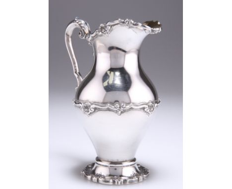 A PORTUGUESE STERLING SILVER JUG, Sheffield Assay Office mark, Porto, first title, of baluster form with leaf-form thumbpiece