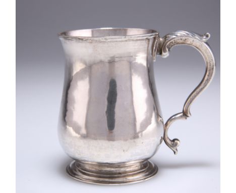 A GEORGE III SILVER MUG,&nbsp;by&nbsp;William &amp; James Priest, London 1771, of baluster form, the scroll handle with leaf-